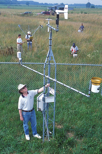 Tom Jackson, shown here at a Soil Climate Analysis Network site in Huntsville, Alabama coordinates in situ soil moisture networks as part of several satellite remote sensing programs, including the recently launched Soil Moisture Active Passive (SMAP) Mission.  Dr. Jackson is currently stationed at NASA’s Jet Propulsion Laboratory in Pasadena, California helping the SMAP Science Team produce a calibrated and validated global soil moisture product. USDA ARS Photo.