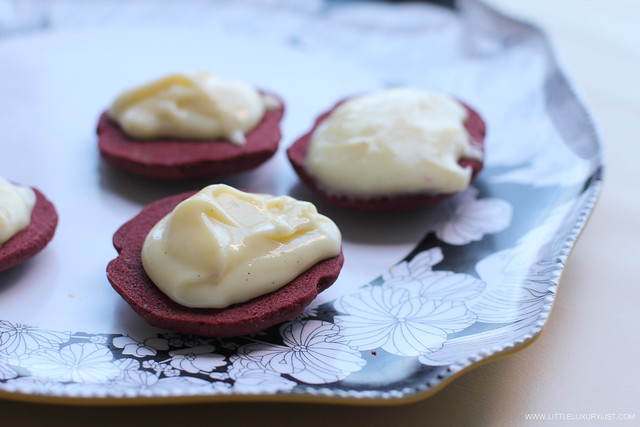 Red velvet whoopie pies open faced with frosting by little luxury list