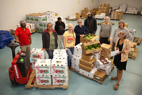 The Common Market team, led by founders Haile Johnston (far left in red shirt) and Tatiana Garcia-Granados (far right in orange sweater), brings food into Philly communities by connecting Mid-Atlantic farmers with wholesale customers. Photo courtesy Common Market.