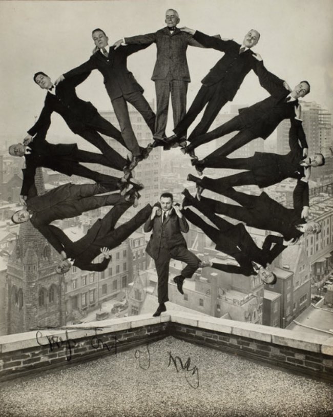Unidentified American artist Man on Rooftop with Eleven Men in Formation on His Shoulders ca. 1930