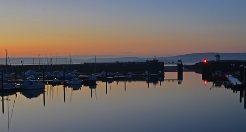 blue orange reflection water sunrise boats coast still llanelli