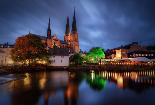 city autumn trees houses sky lake fall church architecture clouds reflections river dark landscape stream exterior cathedral sweden dusk gothic towers uppsala sverige steeples hdr domkyrka waterscape revival fyrisån