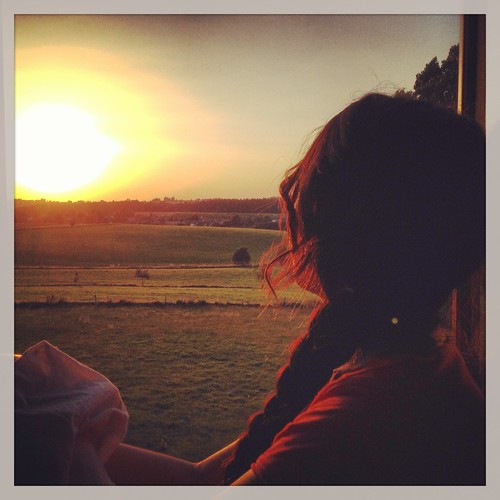 sunset woman side country fields belgi