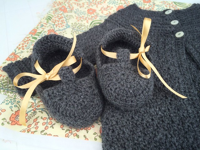 Baby cardigan and booties with a dress to come.