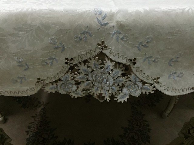 beige, blue table cloth with cut outs