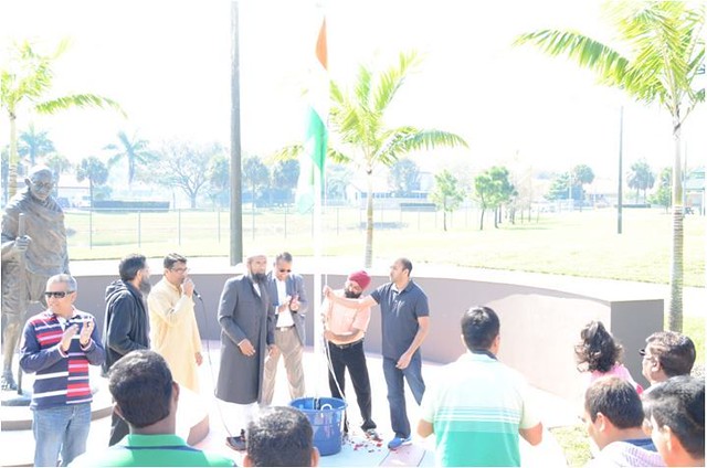 IAMC event in Florida included flag hoisting at the statue of Mahatma Gandhi