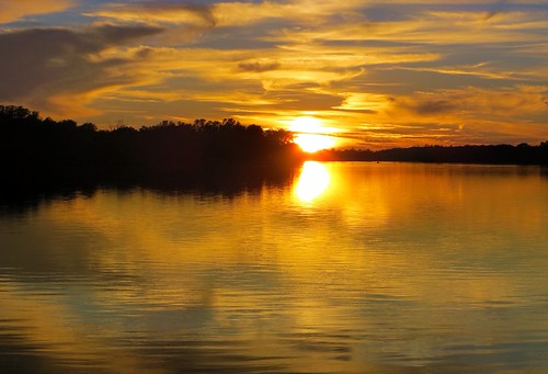 sunset reflection silhouette river grandriver