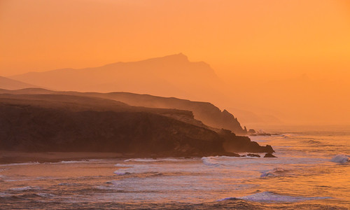 ocean sunset sea orange cliff pared dawn evening abend la meer waves sonnenuntergang fuerteventura dämmerung kliff earthday wellen