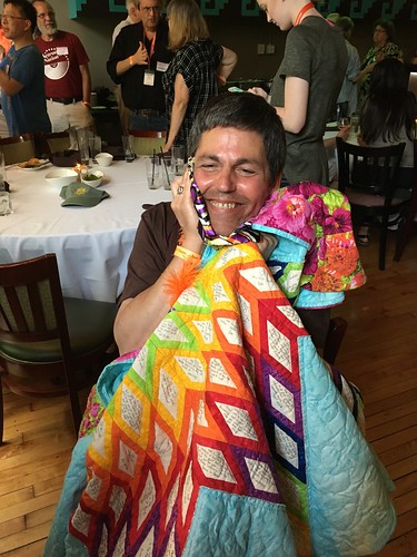 Common Sense Mainer clutching his beloved gift bag made by Cedwyn and the centerpiece of his quilt