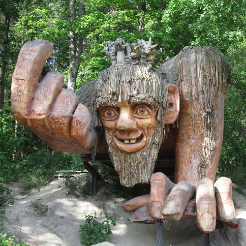 sweden troll wood wooden giant grotesque grin smile finger