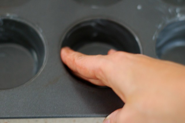 Greasing the muffin tin for popovers by Eve Fox, the Garden of Eating, copyright 2015