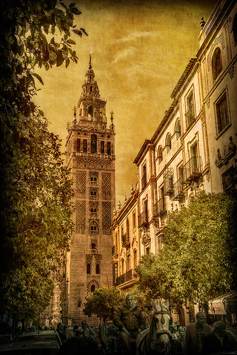 park old city travel blue sky urban building tower art heritage history texture textura tourism church monument beautiful architecture outdoors town sevilla spain ancient europe european cityscape torre exterior view place cathedral symbol artistic minaret famous gothic culture catedral iglesia nobody landmark palace tourist seville andalucia historic spanish moorish romantic historical tradition andalusia giralda attraction texturized texturizado ignaciolinares
