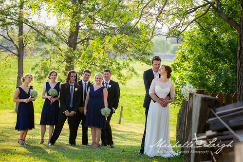 Bridal party looking on.