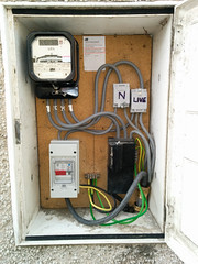 [Electricity meter board with garage supply switch]