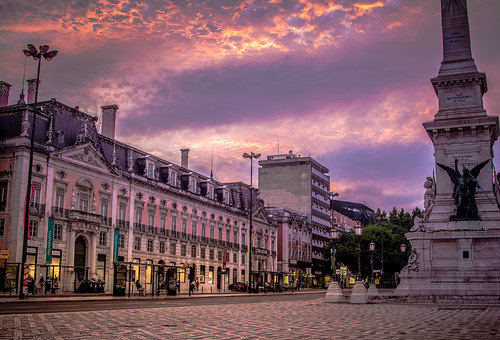 plaza city sunset portugal monument clouds golden evening europe cityscape dusk vibrant lisbon backpacking