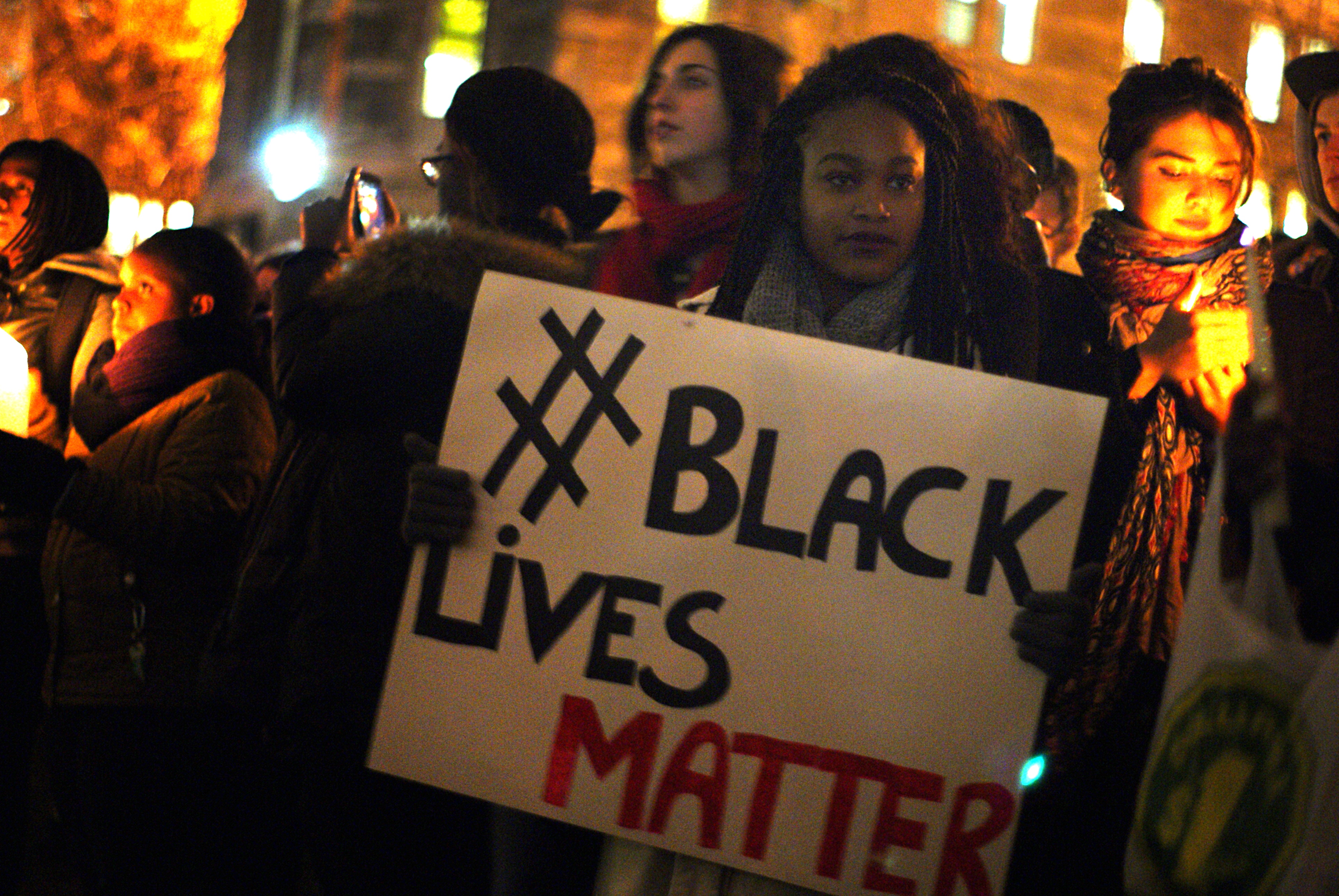 Black Lives Matter protestors with sign 