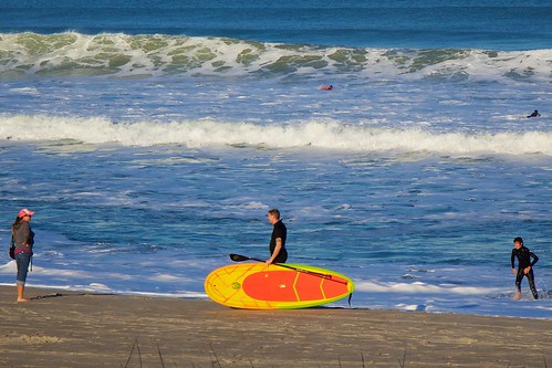 ocean beach surf surfer paddle surfboard wetsuit