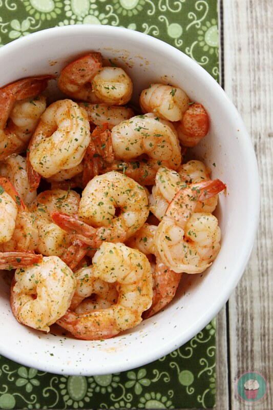 Quick and Easy Cajun Shrimp in a white bowl with a green napkin.