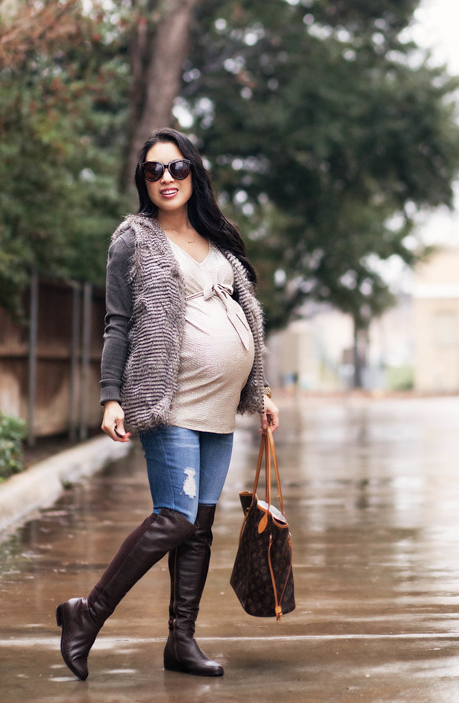 cute & little blog | petite fashion maternity | variegated peacock fur vest, cardigan, gold bow top, distressed jeans, kors otk boots, louis vuitton neverfull | fall winter layering outfit