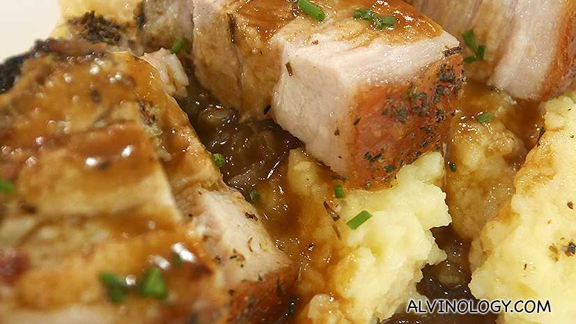 Close-up of the succulent slices of pork belly 