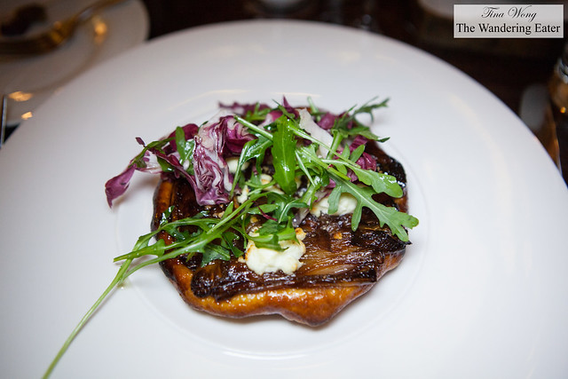 Shallot confit tarte tatin, Pant-Ysgawn goat cheese, winter leaves