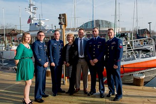 Former service member Seaman Kimberly Fleshman, Petty Officers 3rd Class Jacob S. Wieduwilt and Andrew C. Vardakis, rescued boaters Deborah Hofmann and Brett Wilkinson, Fireman Conor M. Cantwell and Petty Officer 2nd Class Bradley Bishop pose in front of the 45-foot Response boat – Medium used on a July 4, 2014, response to a boating accident on the Severn River near Annapolis, Md. The crew was awarded the Coast Guard Achievement Medal for their actions during the case. (U.S. Coast Guard photo by Petty Officer 2nd Class David R. Marin)
