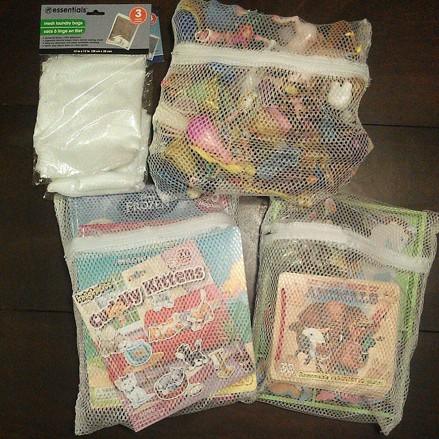 Making more activity packs for the girls. I'm slightly obsessed with this organizational idea. The mesh laundry bags come in a pack of 3 for $1. They are perfect for holding wooden puzzles, so you don't lose the pieces, and a great way to contain all thos