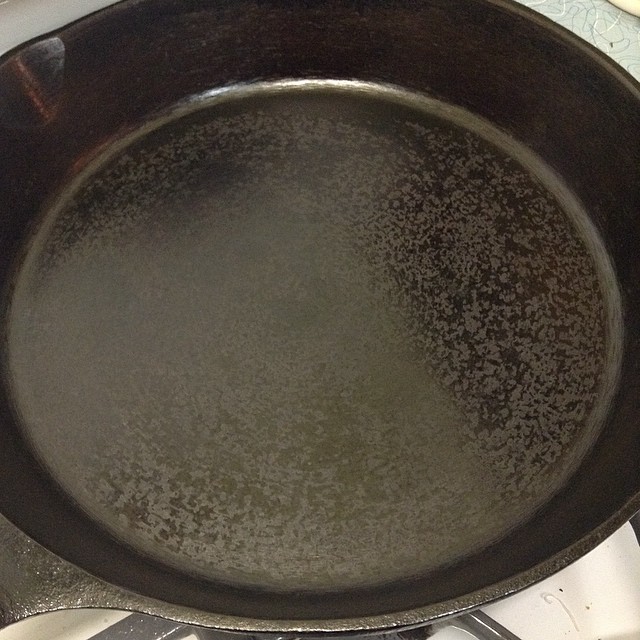 Halfway through seasoning a cast iron skillet on the stove top by Blake Winton