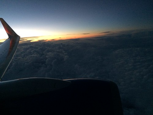 plane southwest sun clouds