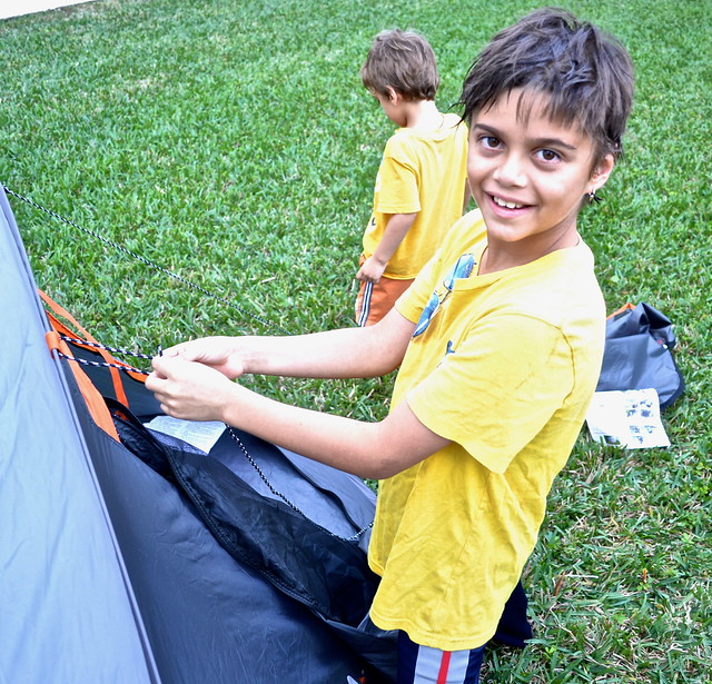 a kids building a rightline pop up tent