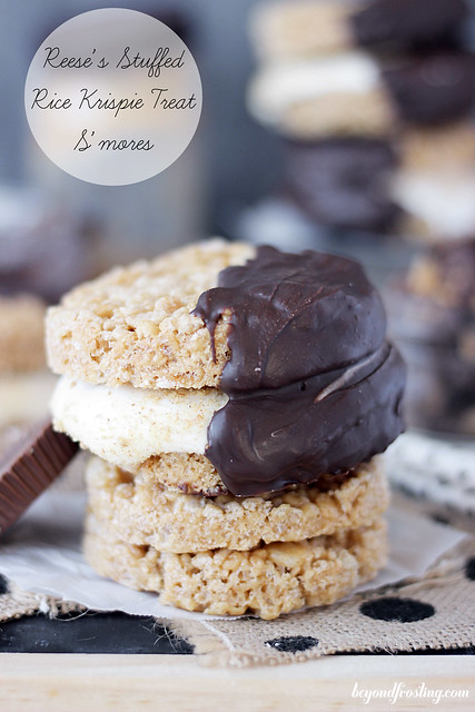Reese's Stuffed Rice Krispie Treat S'mores. It's two thin Rice Krispie Treats that are layered with marshmallow frosting, sprinkled with graham crackers and dipped in chocolate. These also have peanut butter in them! Lot's of peanut butter and a little bit of chocolate!