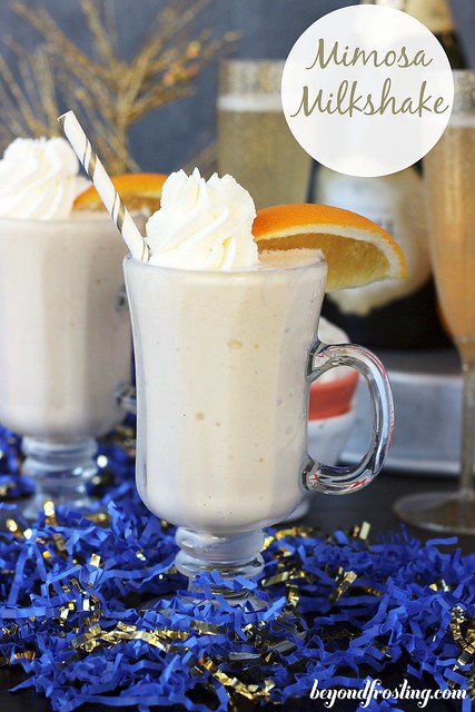 Mimosa Milkshake- A vanilla milkshake made with orange juice and champagne create a bubbly milkshake that will leave you wanting seconds. Serve them in a shot glass for the perfect New Year's Eve Dessert! 