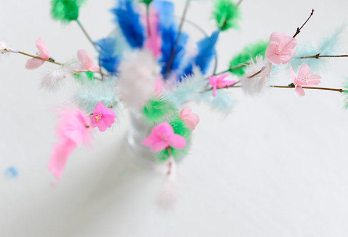 Easter twigs decorated with feathers and paper cherry blossoms