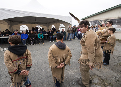 The Jabila’ina Dance Group performs for spectators seated in heated tents during the Opening of the Net.