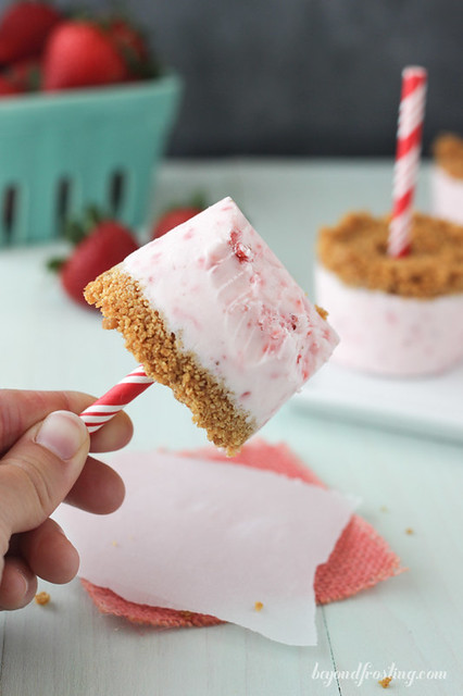 These Easy Strawberry Marshmallow Popsicles are the perfect dessert to make with your kids this summer. They taste just like a strawberry cheesecake and are topped with a graham cracker crust.