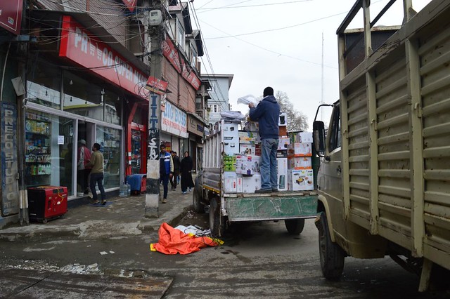 A shopkeeper in Lal Chowk winding up his stock to be taken to a safer place as a result of another flood threat looming large at Srinagar.