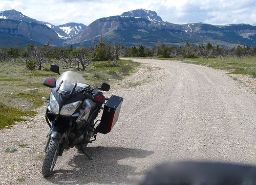 snow mountains spring montana suzuki dl650 vstrom motorcycletouring rockymountainfront
