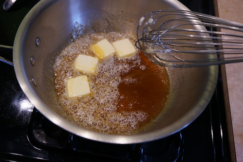 Butter melting into a saucepan of caramel
