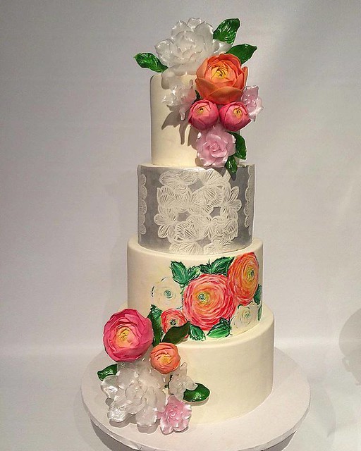 Stunning wedding cake hand painted; pulled sugar gardenias and roses; embossed invitation design; sugar paste ranunculus by Cake Alchemy