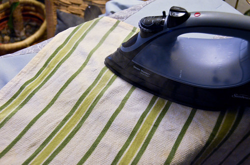 Step 6: Place a damp cloth on top and iron each segment for 10-15 seconds, overlapping where iron was placed.