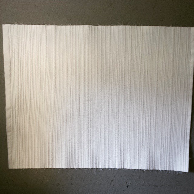 Second side of #WhiteOnWhiteMatchstickQuiltingFTW done! This is 32" x 42". #fbp