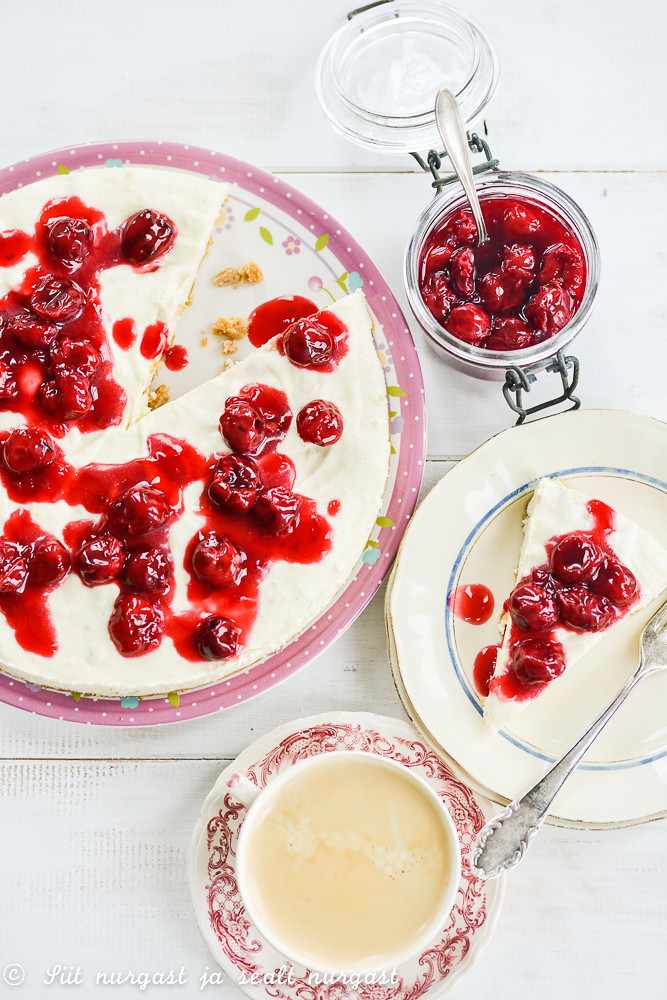 white chocolate cheesecake with cherry compote