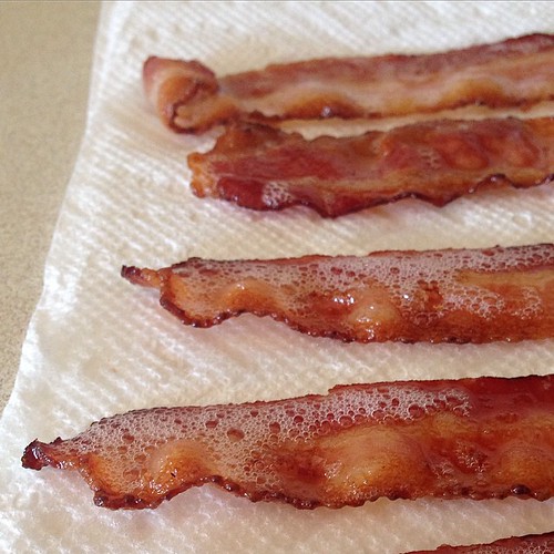 Easiest way to make bacon.  1. Line cookie sheet with edges with foil 2. Place bacon on foil/cookie sheet 3.put in 400° oven for 10-12 minutes.   That's it!  Why did it take so long for me to learn this method!? Bacon frying was such an unpleasant task. T