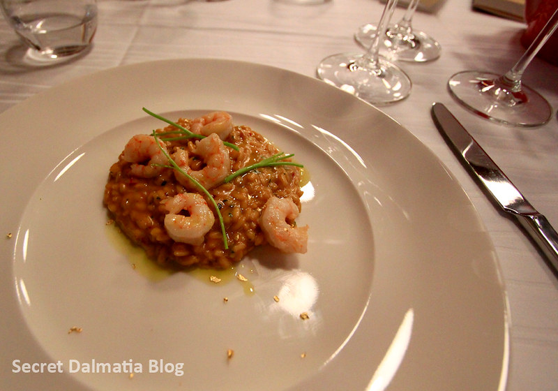 Shrimp risotto with edible 24 karat gold