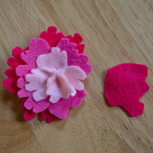 Step 5: Keep attaching larger rows of petals
