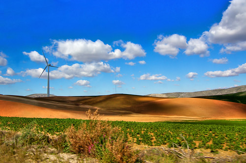 street travel blue vacation sky panorama sun white mountain holiday mountains green tourism nature windmill beautiful rock stone architecture clouds landscape bay coast town spain europe european day village view hill scenic landmark scene tokina spanish tenerife destination f28 tranquil windpower touristic 1116 canon7d