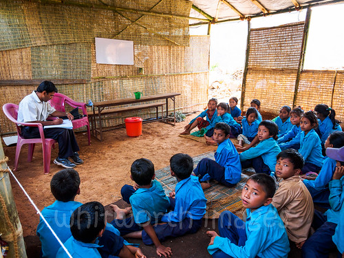 school nepal girls people male boys students female children earthquake asia sitting village floor ground bamboo relief indoors thatch shelter temporary himalayas nepali naturaldisaster disasterrelief 2015 indiansubcontinent kumpur dhadhing nepalearthquake2015