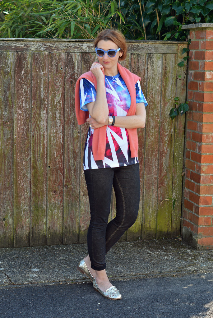 Graphic t-shirt, coral sweater, skinnies and metallic woven loafers