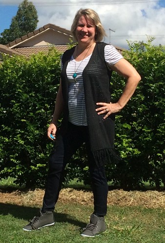 Planning a travel wardrobe - layers featuring Millers fringed vest and denim jeggings