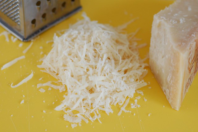 Grating Parmesan cheese by Eve Fox, the Garden of Eating, copyright 2015
